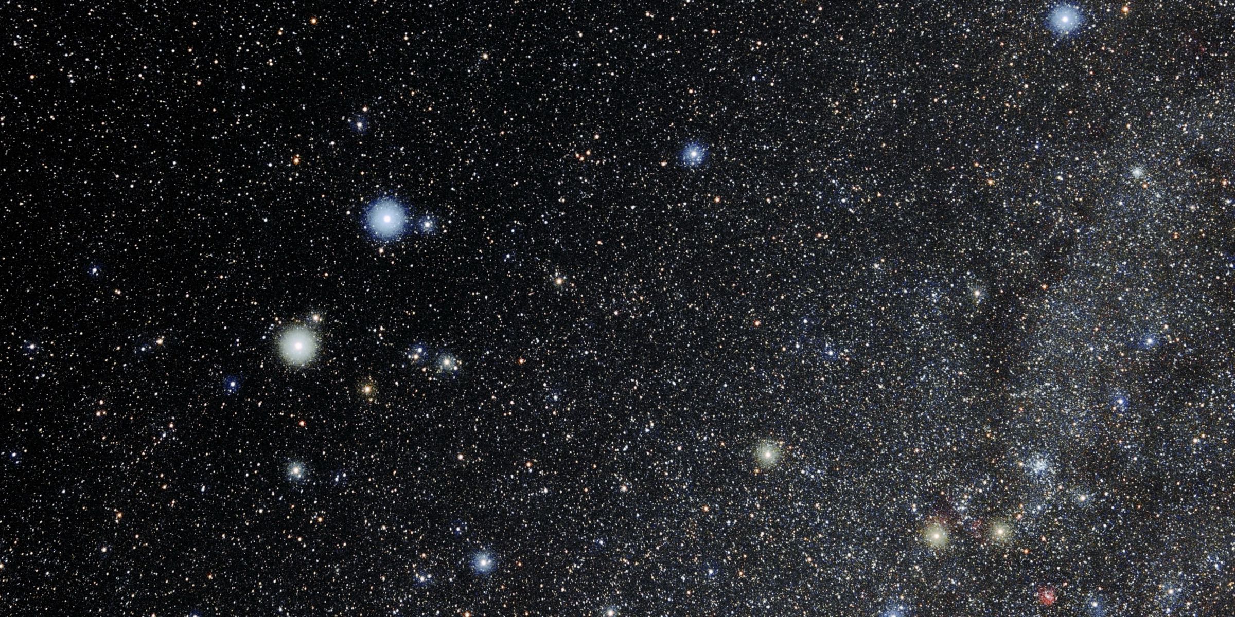 The constellation Gemini in a dark sky full of stars, with the Milky Way along one side.
